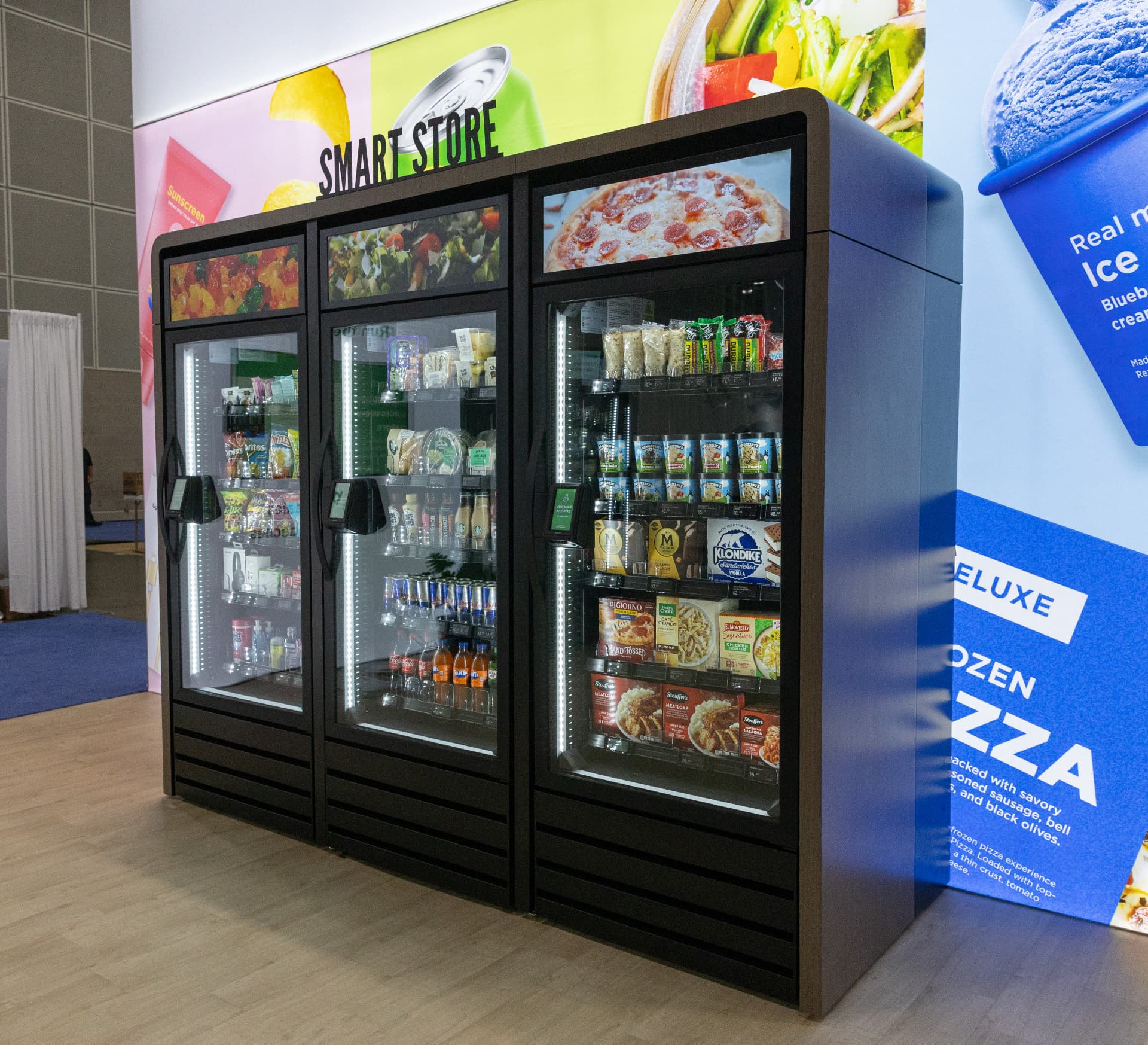 ARC Vending micromart interior stocked with healthy snacks, protein bars, energy drinks, coffee, toiletries, tech essentials, and frozen selections